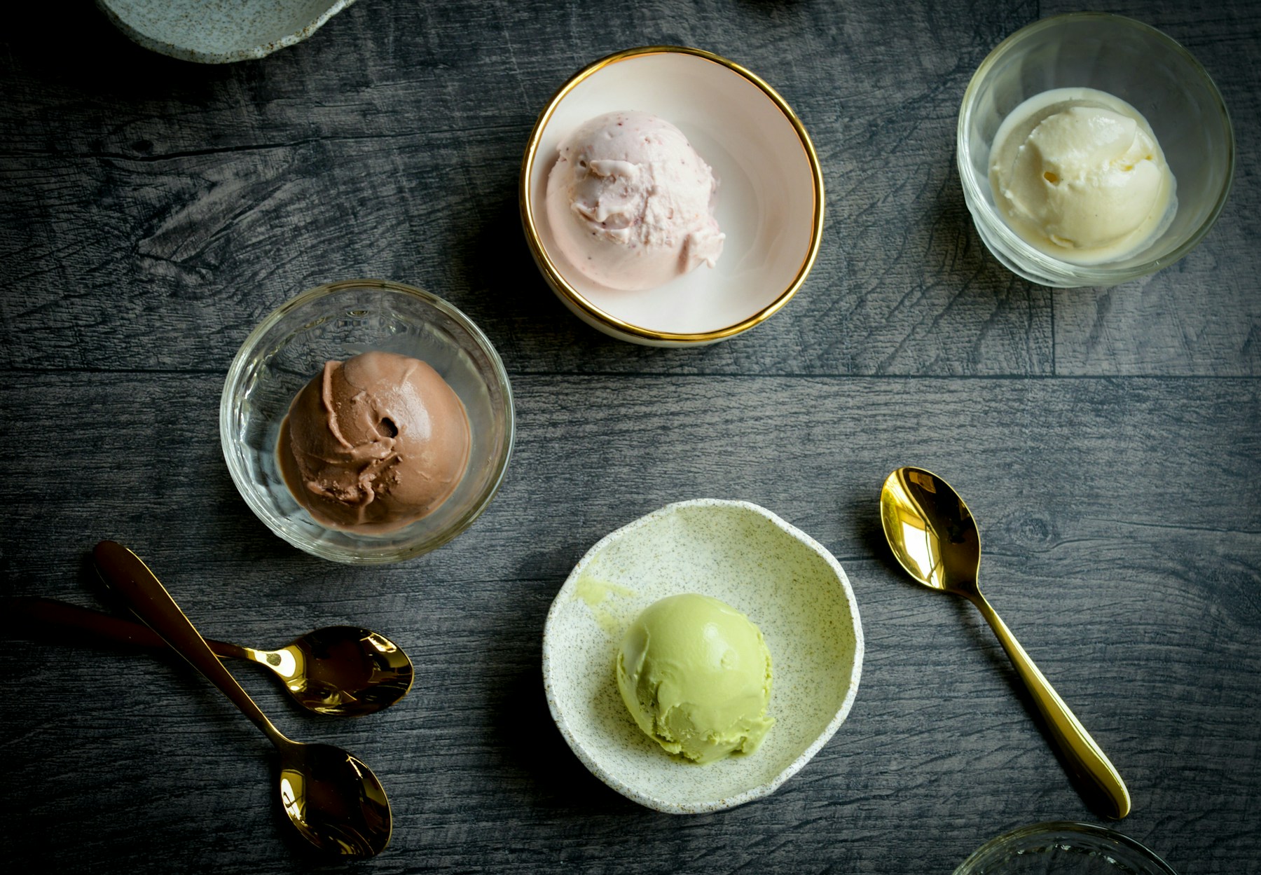 A selection of ice cream scoops in small bowls